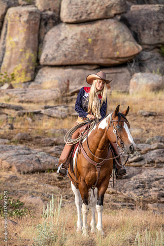 Cowgirl on Paint Horse photo