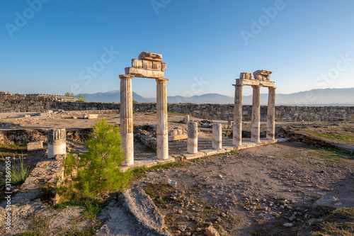 Beautiful view of the ancient ruins of the Roman city of Hierapolis in Pamukkale, Turkey. The site is a UNESCO World Heritage site near the city of Denizli. 
