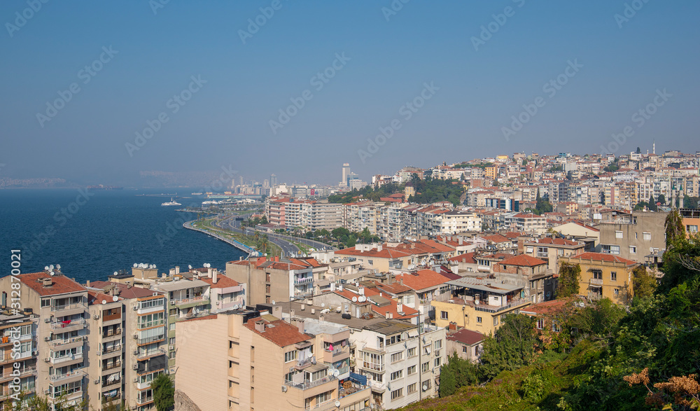 View over Konak district of Izmir, Turkey, with residential buildings. Gulf of Izmir on the Aegean Sea and the seaport terminal. View over Konak district of Izmir, Turkey, with residential buildings. Gulf of Izmir on the Aegean Sea and the seaport terminal.