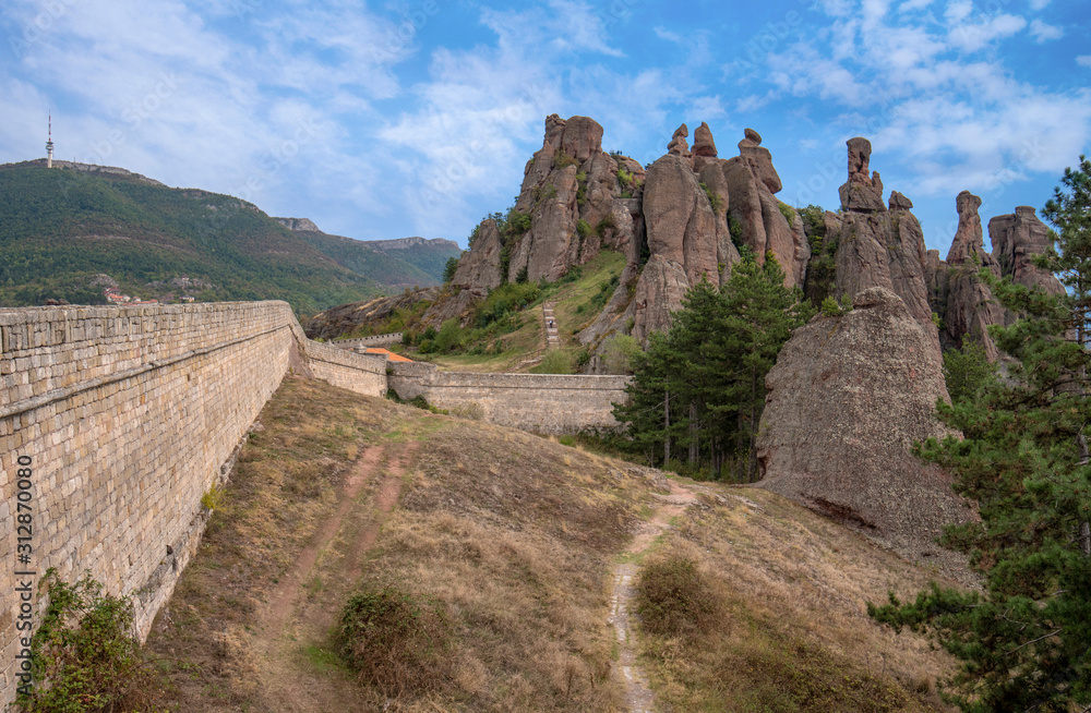 Beautiful landscape with bizarre rock formations. Stone stairs leading to the amazing rock formations and walls of a medieval fortress in Belogradchik, northwest Bulgaria. Panorama