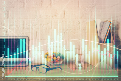 Financial market graph hologram and personal computer on background. Double exposure. Concept of forex. © peshkova