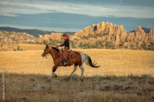 Cowgirl on Paint Horse photo