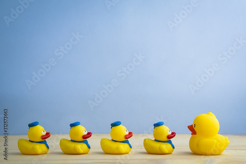 Leadership concept yellow rubber duck leading group