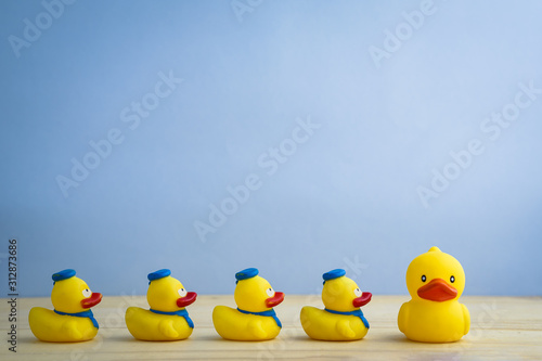 Leadership concept yellow rubber duck leading group