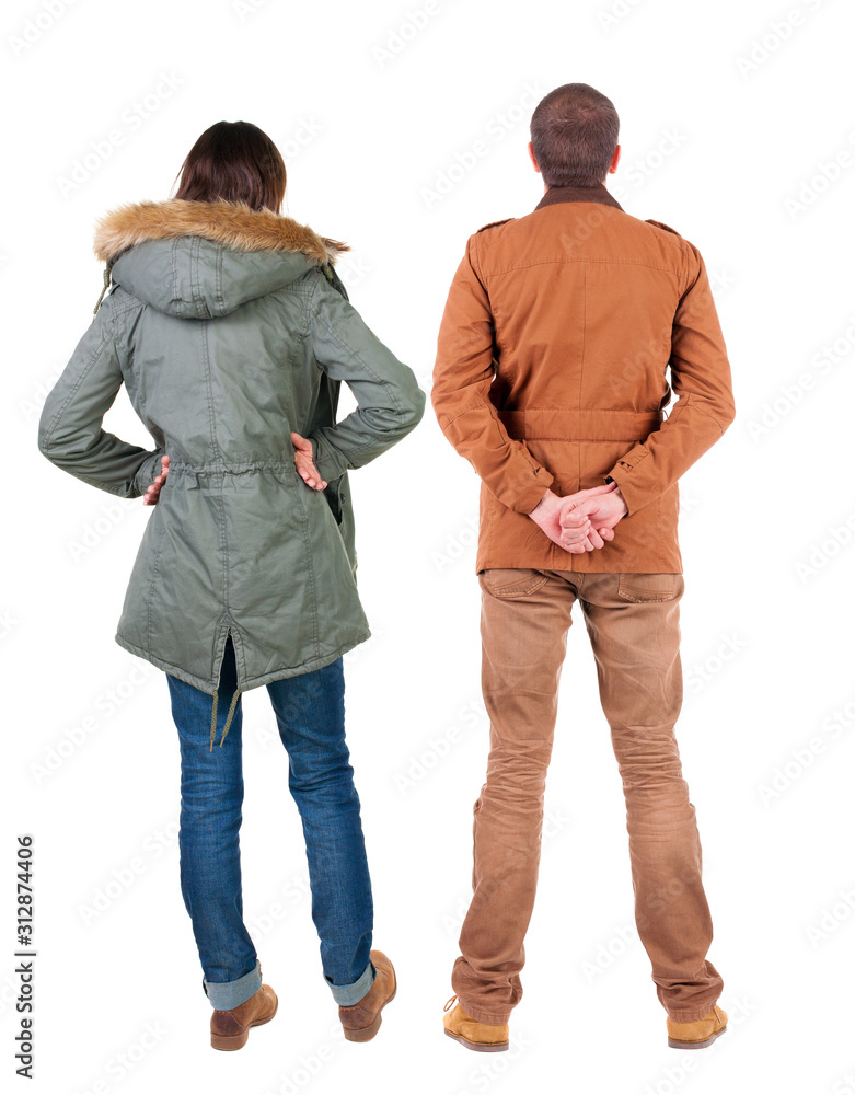 Back view of couple in winter jacket. Back view of couple in winter jacket.