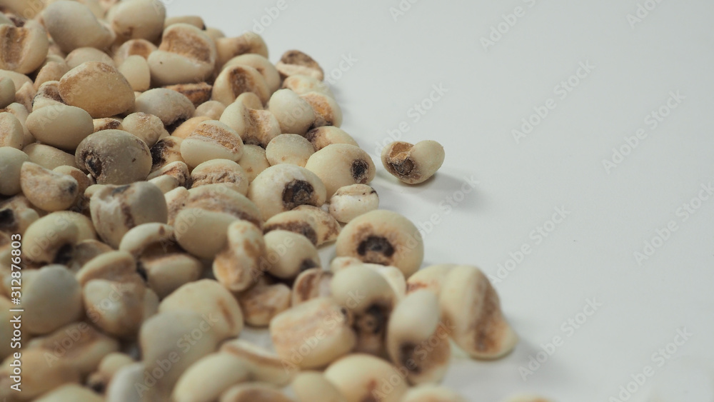 Job's Tears, also known as adlay and coix on calico background. Popular in Asian cultures as a food source. Job's Tears, also known as adlay and coix on calico background. Popular in Asian cultures as a food source.