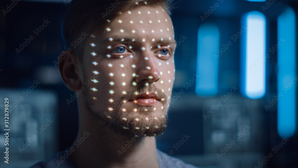 Handsome Young Caucasian Man is Identified by Biometric Facial Recognition  Scanning Process. Futuristic Concept: Projector Identifies Individual by  Illuminating Face by Dots and Scanning with Laser Stock Photo | Adobe Stock