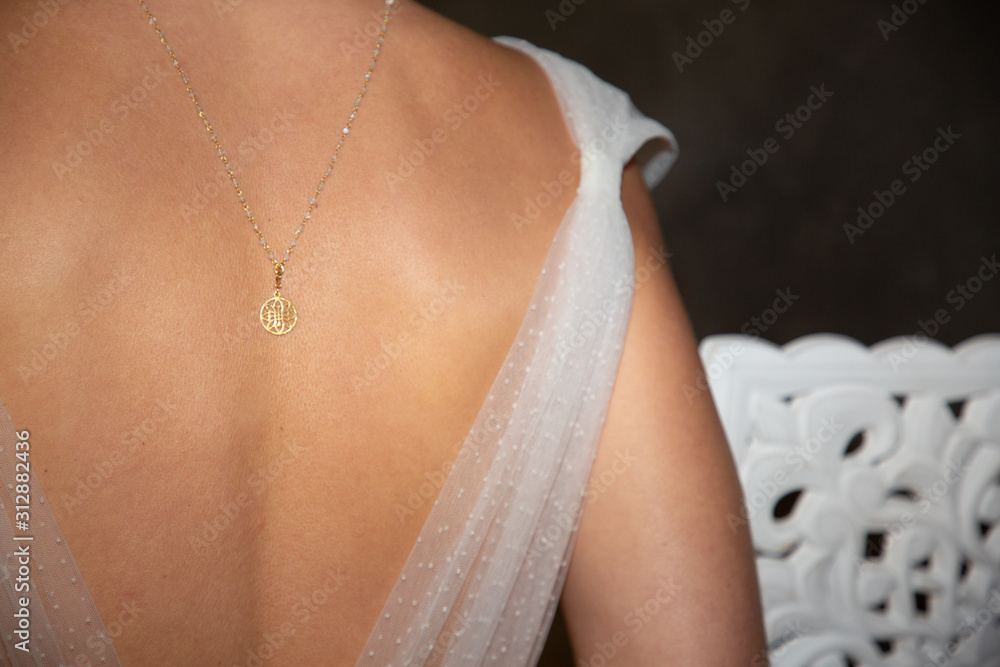 necklace behind on the woman bride back neck rear wedding day