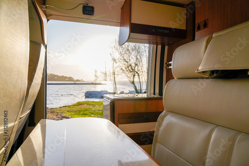 interior Camper van rv sunrise in spot park like vanlife in summer at Lacanau lake France