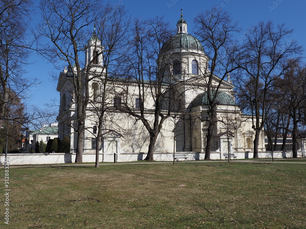 Obraz premium Park with collegiate church of Saint Anne in Wilanow quarter of Warsaw in Poland