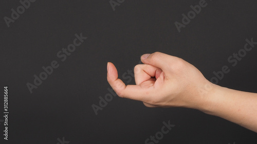 Photography The Come Hither Hand Sign on black background