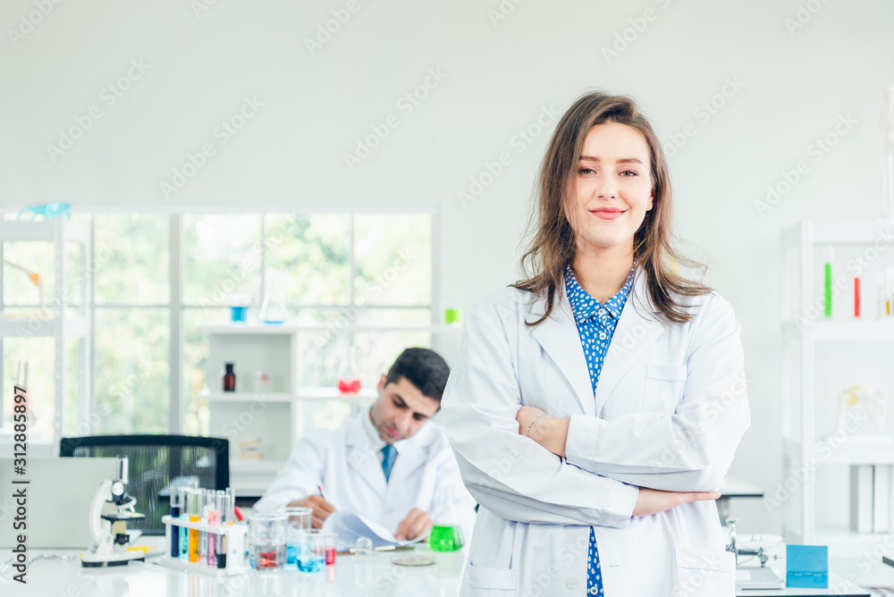 Portrait of young asian doctor isolated on lab background