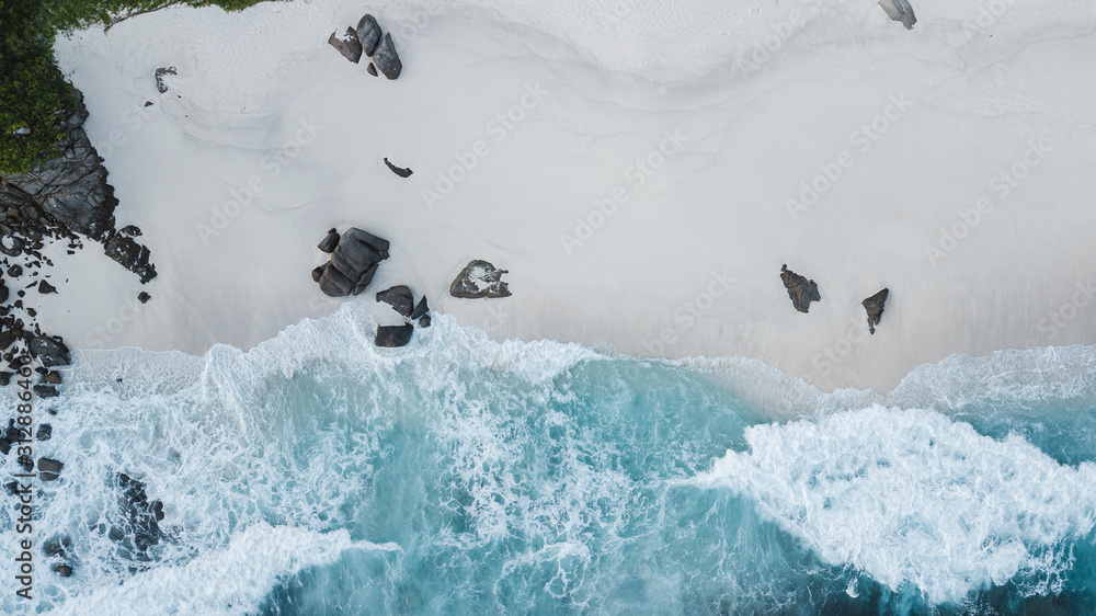 Aerial view of beautiful island at Seychelles in the Indian Ocean. Top view from drone. Spectacular aerial view of some yachts and small boats floating on a clear and turquoise sea, Seychelles in the Aerial view of beautiful island at Seychelles in the Indian Ocean. Top view from drone. Spectacular aerial view of some yachts and small boats floating on a clear and turquoise sea, Seychelles in the