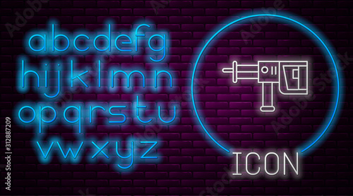 Glowing neon line Electric rotary hammer drill machine icon isolated on brick wall background. Working tool for construction, finishing, repair work. Neon light alphabet. Vector Illustration