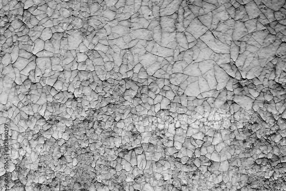 Texture of a concrete wall with cracks and scratches which can be used as a background Texture of a concrete wall with cracks and scratches which can be used as a background