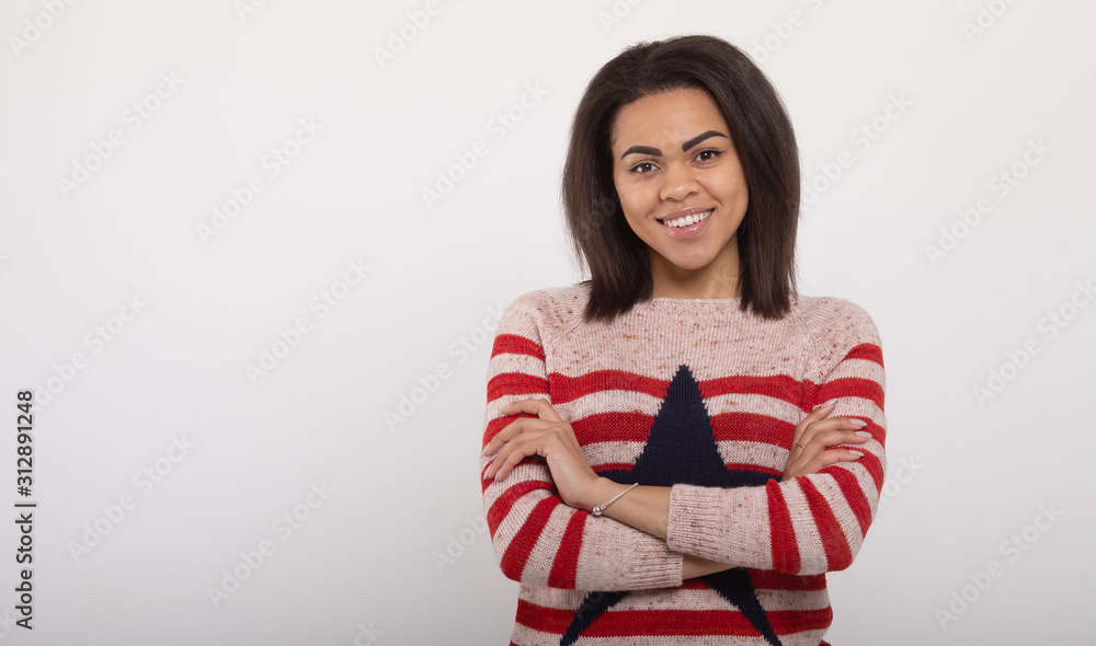 Portrait of beautiful positive african american woman standing on white background. Portrait of beautiful positive african american woman standing on white background.