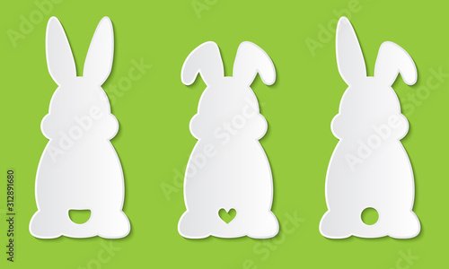 Laser cut template. Set of clipart Easter rabbits with ears and tail. For Happy Easter hunt. Vector silhouette of back of fun bunny. Sample illustration isolated on green background. Die cut paper.