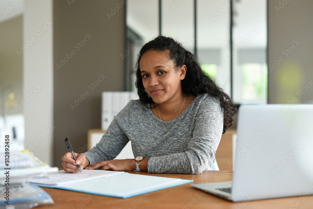 metis woman working in office metis woman working in office