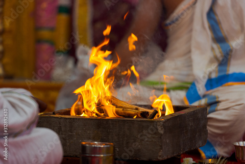 Burning fireplace during a Hindu baptism ceremony photo