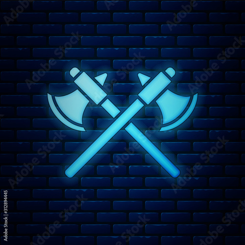 Glowing neon Crossed medieval axes icon isolated on brick wall background. Battle axe, executioner axe. Vector Illustration