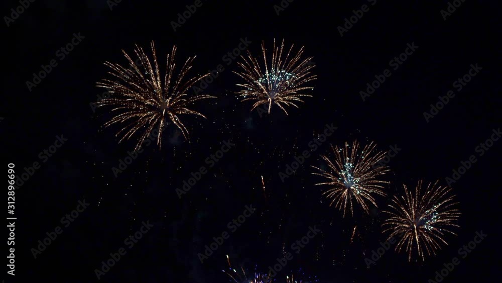 Beautiful abstract colourful Fireworks explode display on sky at night a symbol of celebration in New years anniversary for background Beautiful abstract colourful Fireworks explode display on sky at night a symbol of celebration in New years anniversary for background