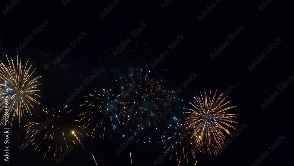 Beautiful abstract colourful Fireworks explode display on sky at night a symbol of celebration in New years anniversary for background Beautiful abstract colourful Fireworks explode display on sky at night a symbol of celebration in New years anniversary for background