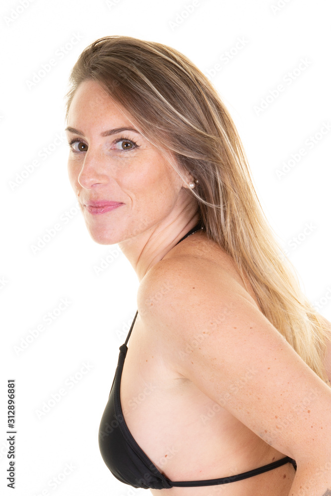Attractive young woman with long blond hair dressed in top swimwear makeup and beautiful smile posing in summer on white background Attractive young woman with long blond hair dressed in top swimwear makeup and beautiful smile posing in summer on white background