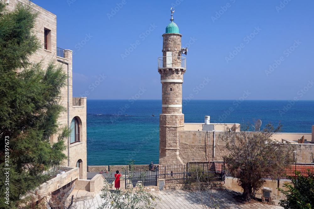   Old town, Lighthouse and  port of Jaffa and modern skyline of Tel Aviv city, Israel 