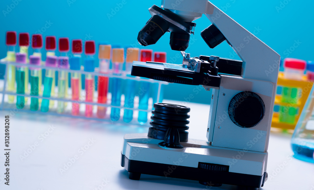 Fototapeta premium Test tubes and flasks and microscope in a chemical laboratory