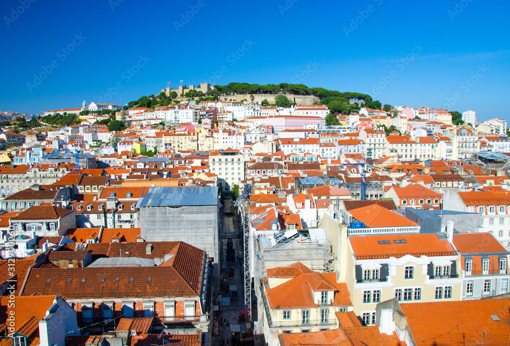 Portugal, night panoramic view of Lisbon in summer, Lisbon fortress hill сlose-up, touristic centre of Lisbon, St. George's medieval Castle in Lisbon, forest on the highest hill in Lisbon
