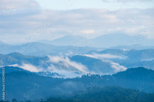 beauty sky and clouds with magical fog and light cover in valley and majestic of mountain range, best photo use for idea design, printing, data and more