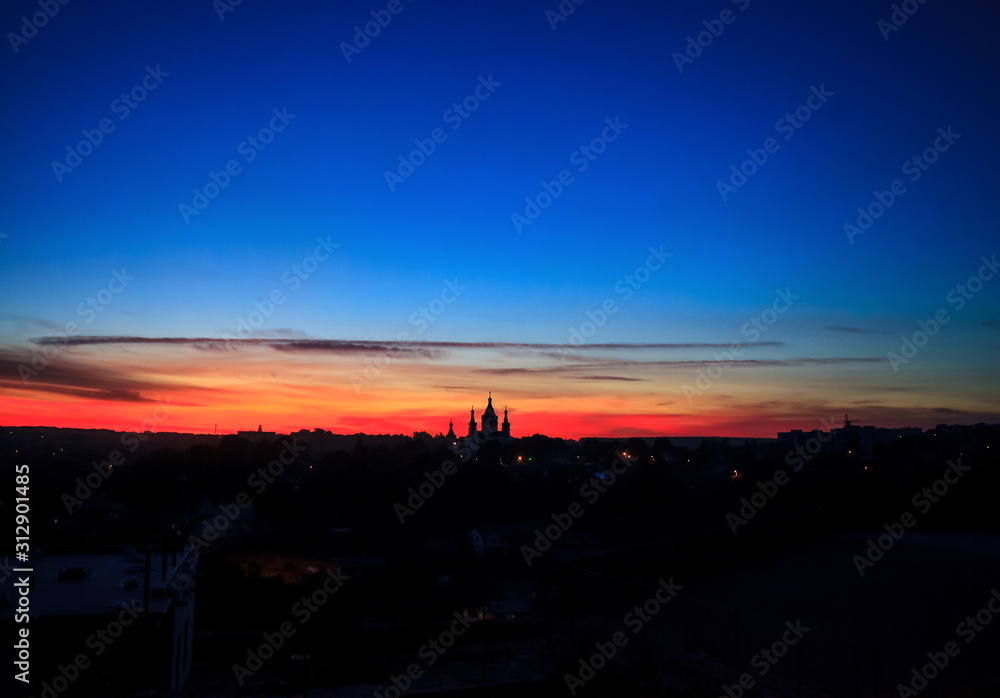 Night black silhouette of cityscape Kamianets-Podilskyi in Ukraine