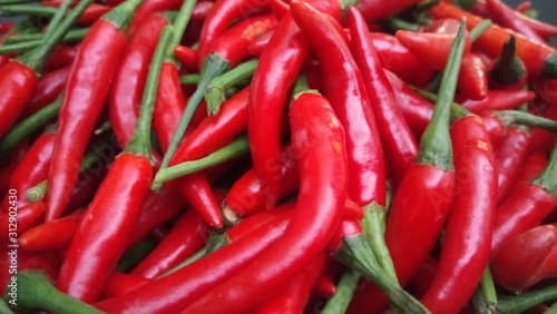 red chili peppers on a wooden background