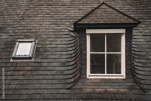 old gray shingle roof white window frame background of medieval European north architecture building in Stockholm Sweden entourage urban style picture