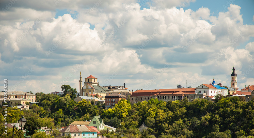 European village historical place with cathedral church and old living building in green park area environment summer time cloudscape sky background