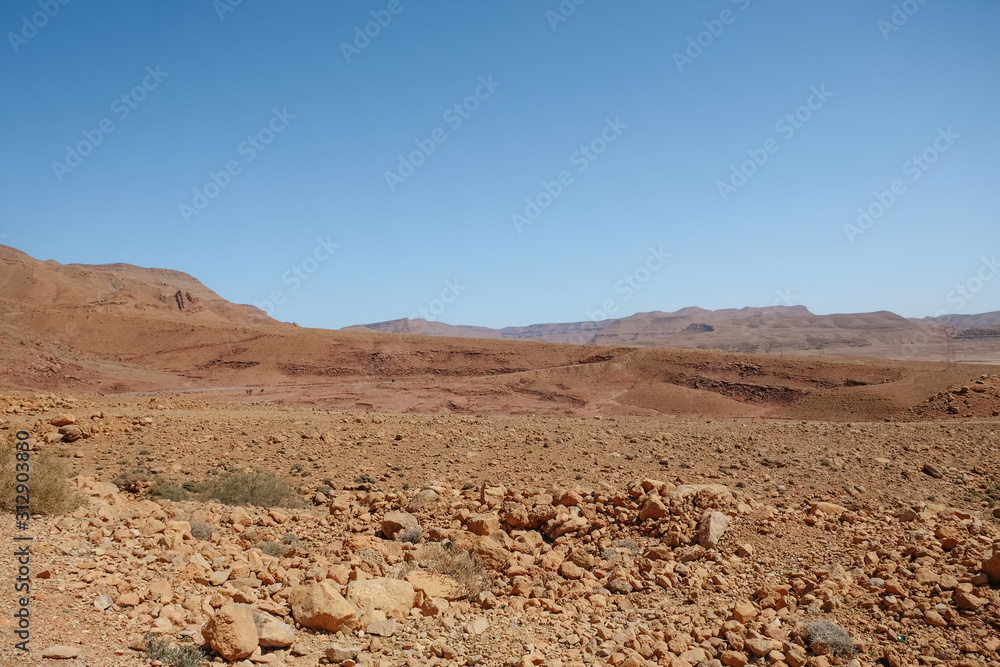 Drought land desert arid landscape against clear blue sky