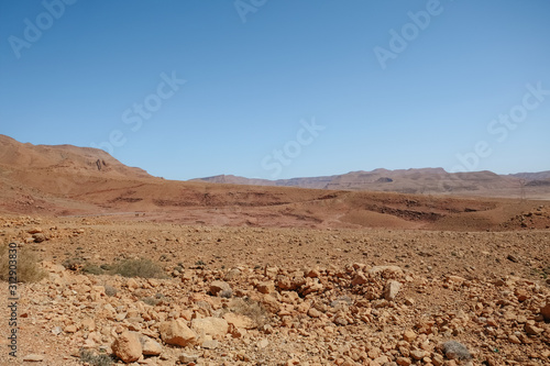 Drought land desert arid landscape against clear blue sky