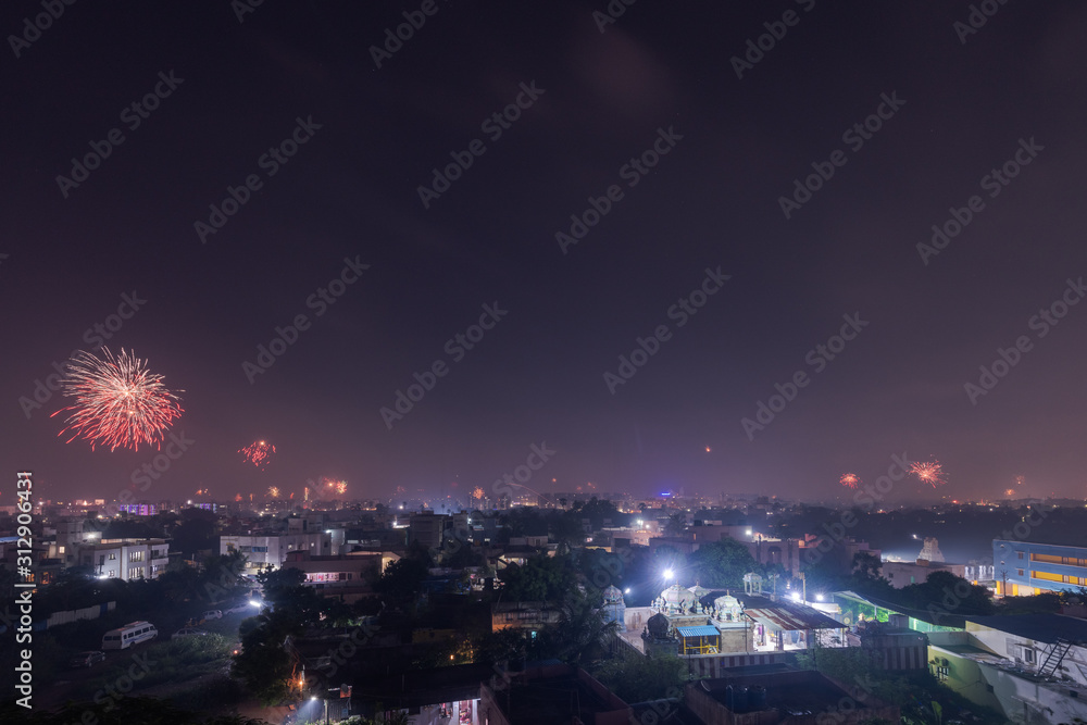 Bursting fireworks during the Divali festival of light over the city of Chennai in South India