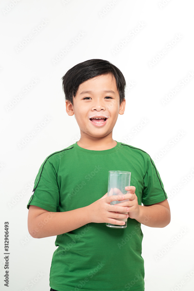 Cute boy drinking milk on light background Cute boy drinking milk on light background