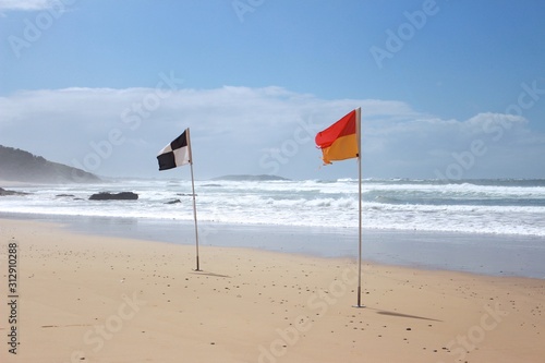 Safety Flags with beach in the background
