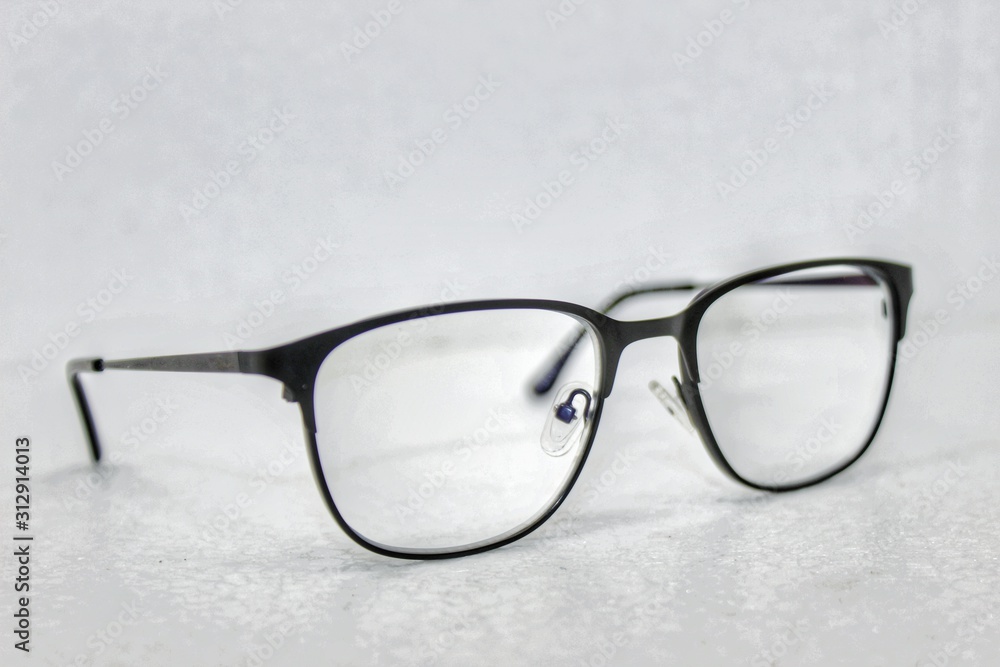 fashion eye glass in a white background and wallpaper