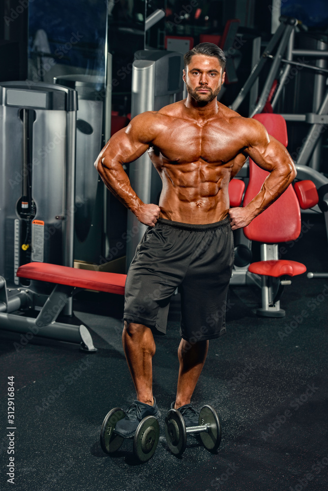 Bodybuilder Exercise With Weights at the Gym Bodybuilder Exercise With Weights at the Gym