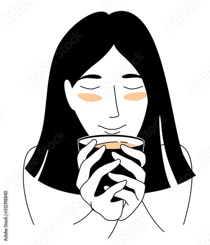 Young woman enjoys drinking tea holding mug with both hands