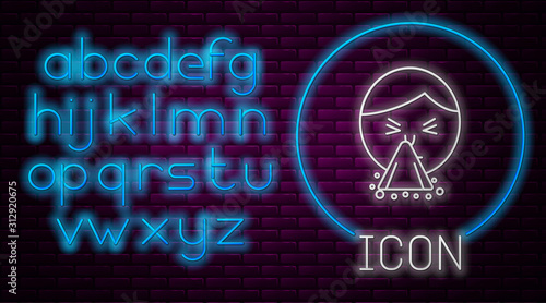 Glowing neon line Man holding handkerchief or napkin to his runny nose icon isolated on brick wall background. Coryza desease symptoms. Neon light alphabet. Vector Illustration