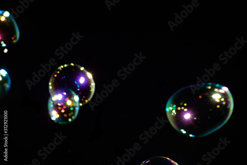 Blurred background with colorful soap bubbles is close