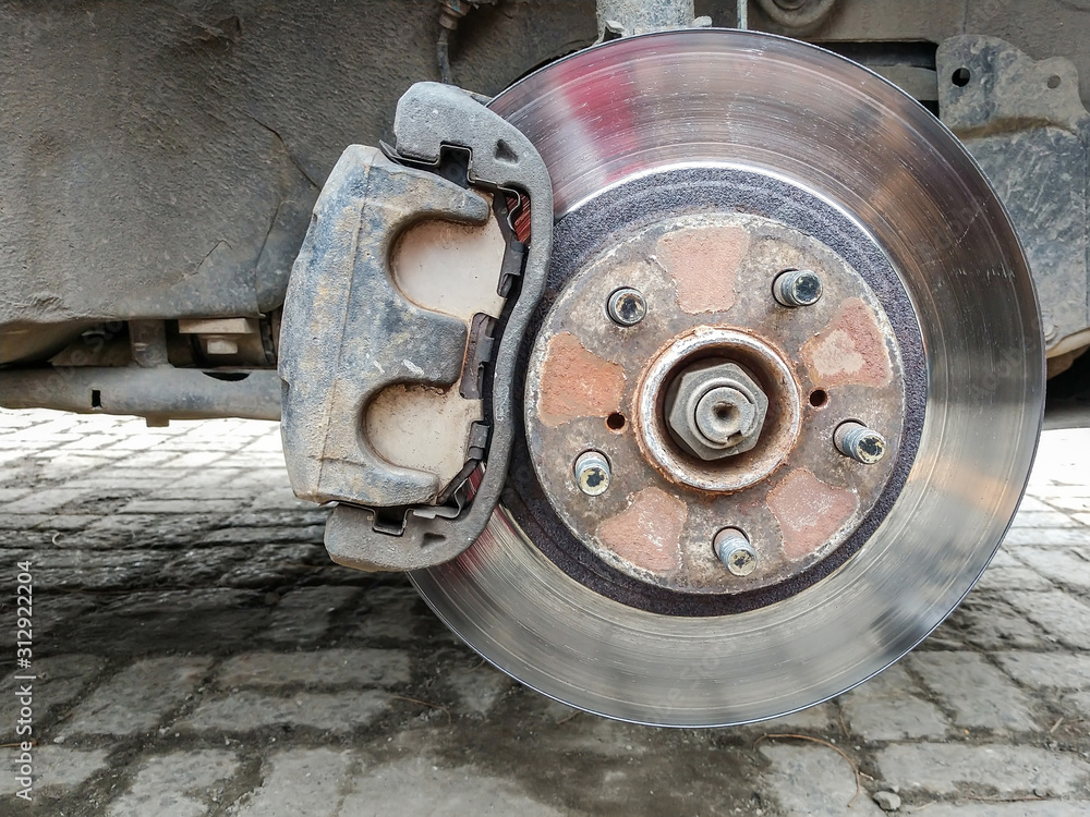Car without a wheel. Replacing on the tire service center Car without a wheel. Replacing on the tire service center