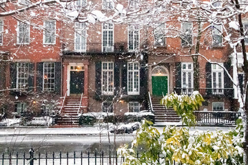 Snow covered streets and sidewalks along Washington Square Park during a winter storm in New York City