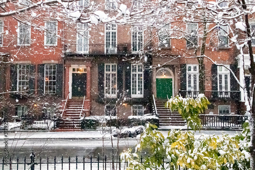 Snow covered streets and sidewalks along Washington Square Park during a winter storm in New York City