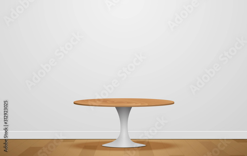wooden round table in the white studio room