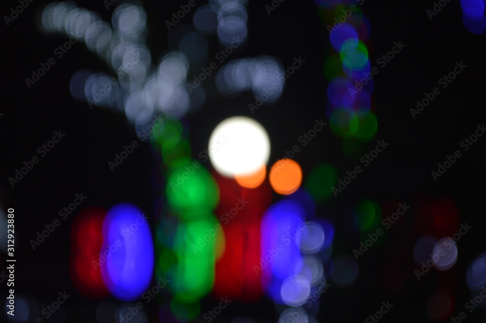 Bokeh of lights decorated in trees And the bright light post Bokeh of lights decorated in trees And the bright light post